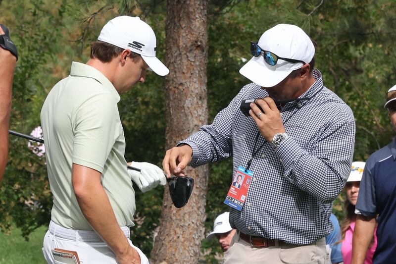 A rules official looks at the cracked driver of Matt Fitzpatrick on the 8th tee during the final round of the BMW Championship at Castle Pines GC in Castle Rock, Colorado. Photograph: Scott Winters/Icon Sportswire via Getty Images