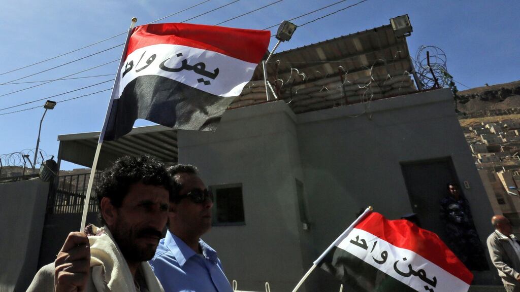 People hold Yemeni flags during an anti-Saudi rally protesting the Saudi-led military operations, outside the UN offices in Sana’a, Yemen. Photgraph: Yahya Arhab/EPA