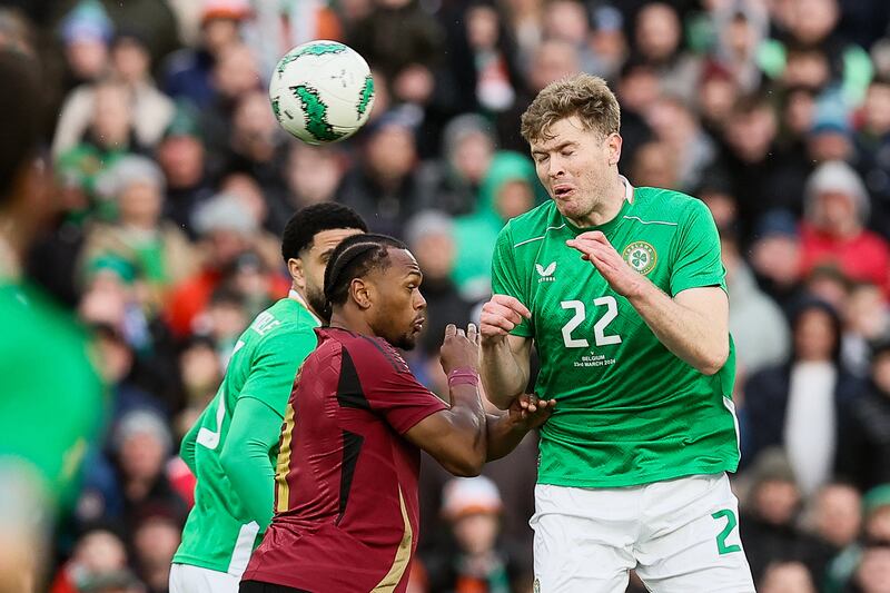 Belgium's Lois Openda and Irish Nathan Collins fight for the ball. Photograph: Bruno Fahy/Belga Mag/AFP via Getty