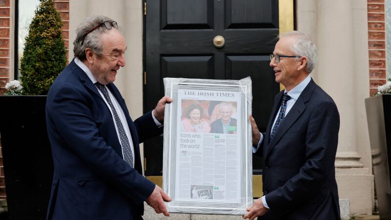 Irish Times sports editor Malachy Logan presents Sport Ireland   chief executive  John Treacy with a framed Irish Times front page to mark  his retirement. Photograph:  Alan Betson