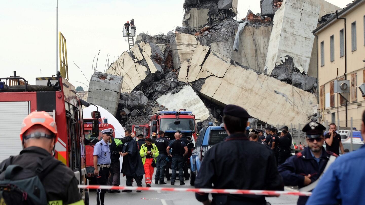 Rescuers are at work amid the rubble of a section of a giant motorway bridge that collapsed  in Genoa. Photograph: Andrea Leoni/AFP/Getty Images