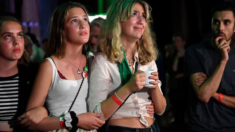 Supporters of the Miljopartiet (Green Party) watch election night updates in central Stockholm. Photograph: EPA