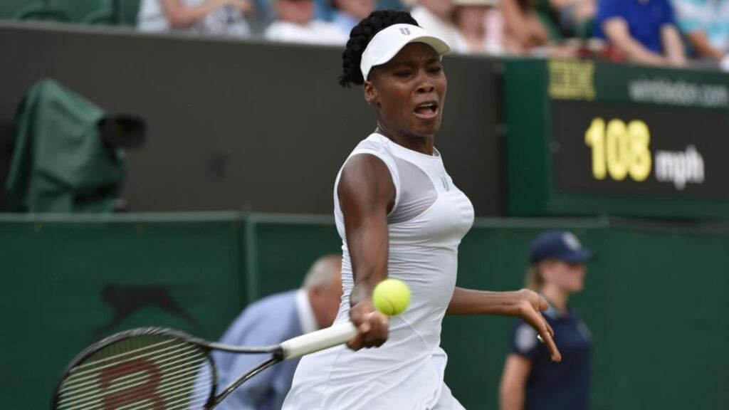Venus Williams hits a return to Maria-Teresa Torro-Flor of Spain during their women’s singles tennis match at the Wimbledon Tennis Championships, in London. Photograph: Reuters