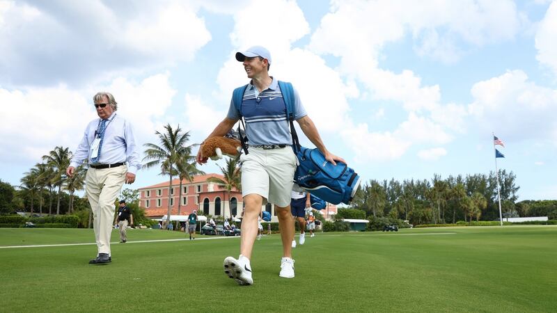 Rory McIlroy carries his own bag as he walks from the 10th tee during the TaylorMade Driving Relief charity event in Florida. Photograph: Mike Ehrmann/Getty