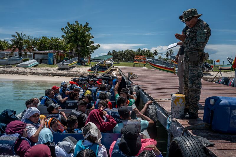 An officer with Panama’s National Border Service at a checkpoint for migrant boats on the island of El Porvenir, in the San Blas archipelago of Panama. Photograph: Federico Rios Escobar/New York Times