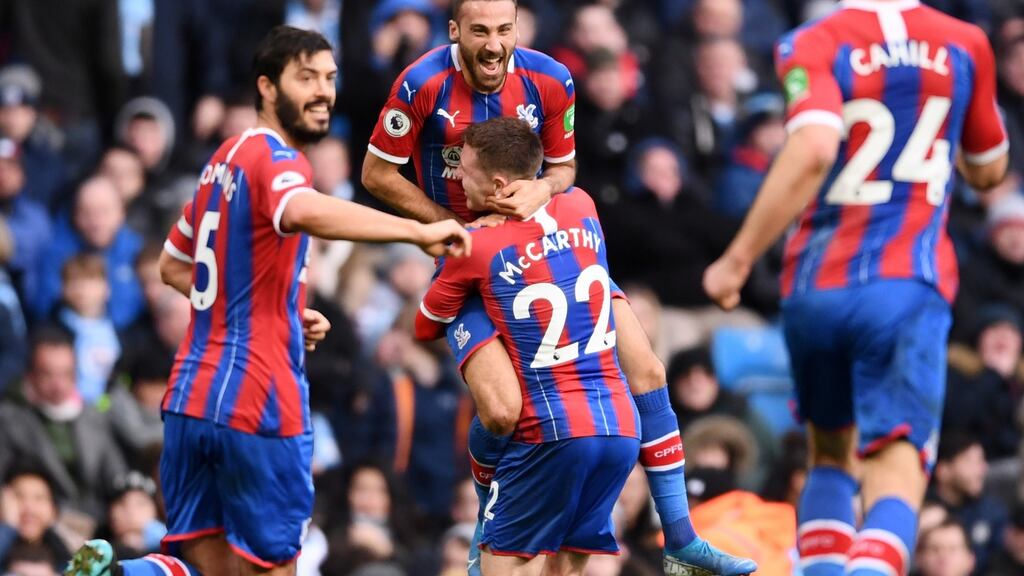 Cenk Tosun of Crystal Palace celebrates with teammates James McCarthy, James Tomkins and Gary Cahill of Crystal Palace after scoring his side’s first goal against Manchester City. Photograph: Laurence Griffiths/Getty