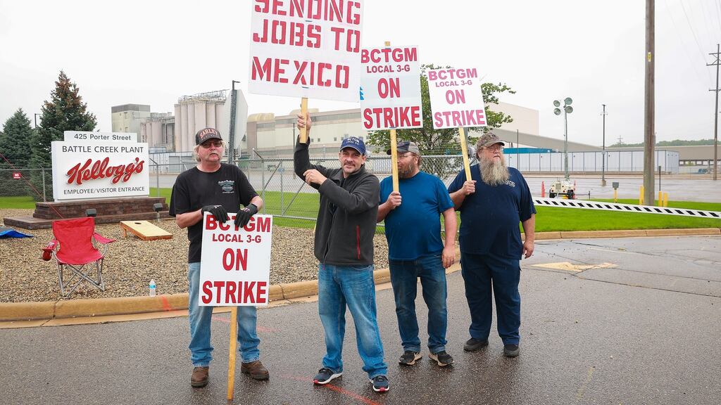 Kellogg’s cereal plant workers demonstrate in front of the plant in Battle Creek, Michigan, over the loss of premium healthcare, holiday and vacation pay, and reduced retirement benefits. Photograph: Rey Del Rio/Getty