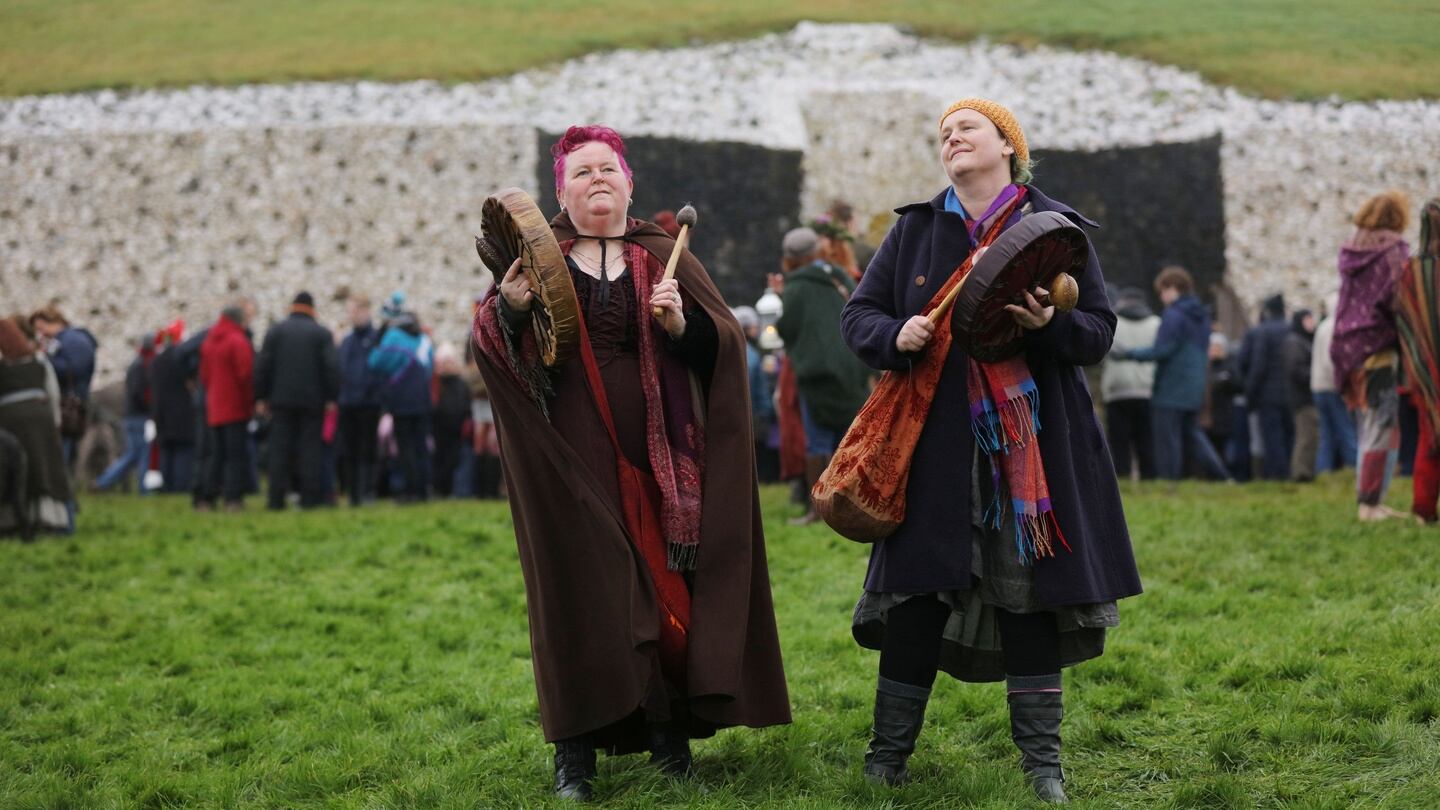 Val Murphy and Maire de Vhal from Cavan at Newgrange for the Winter Solstice. Misty weather blocked the Winter Solstice sunrise from entering the chamber. Photograph: Alan Betson/The Irish Times