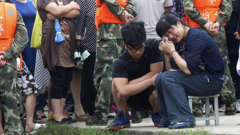 Frustrated by the scarcity of information from local authorities, about 50 family members hired a bus to take them from Nanjing to Jianli county in Hubei, an eight-hour journey. Photograph: AFP/Getty Images