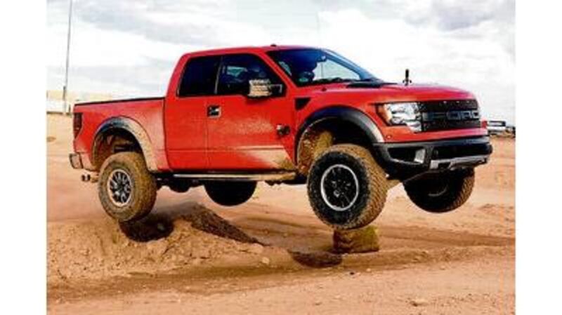 Main picture: Ford's Raptor 6.2-litre petrol pick-up; left: the new European-styled Ford Focus at its launch in Detroit; below: Ford's Fusion Hybrid range