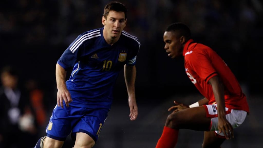 Argentina’s Lionel Messi is challenged by Trinindad and Tobago’s Joevin Jones. Photograph: Martin Acosta/Reuters