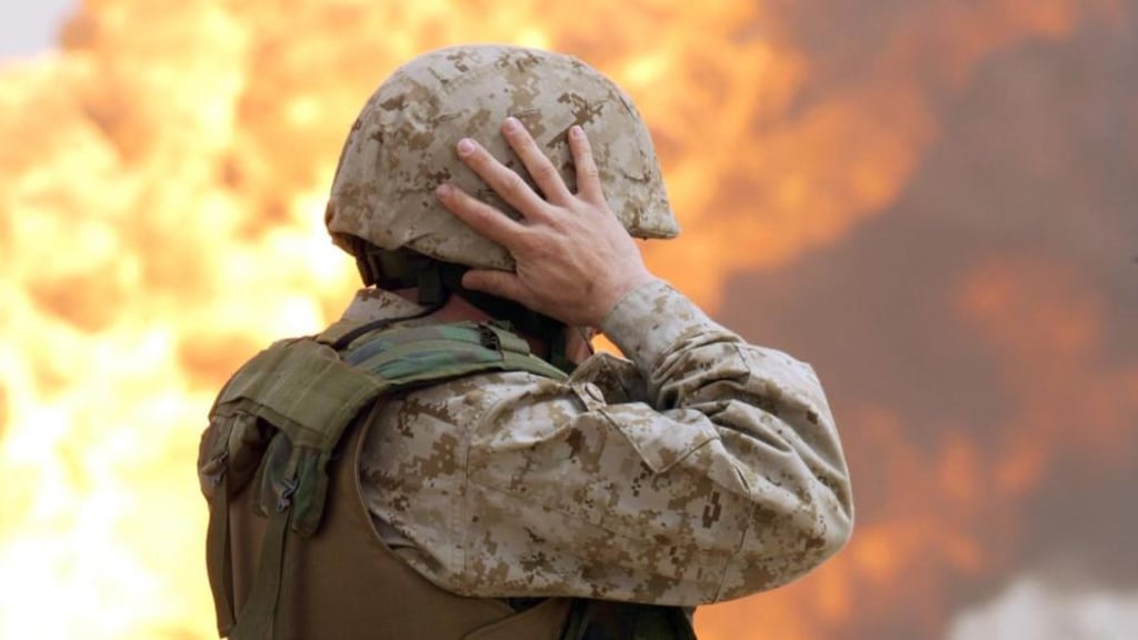 Flash point: a US soldier at a burning Iraqi oilfield in 2003. Photograph: Anja Niedringhaus/AP