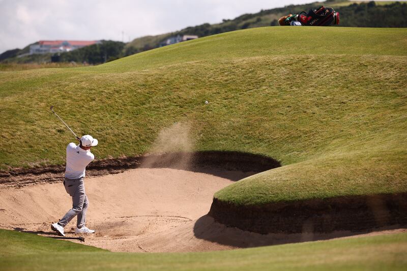 US golfer Collin Morikawa plays from a bunker onto the 14th green during a practice round at Royal Portrush on Wednesday. Photograph: Henry Nicholls/AFP via Getty Images