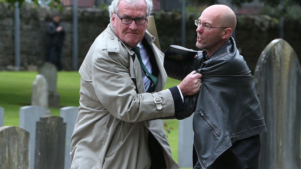 Canadian ambassador to Ireland Kevin Vickers (left) wrestles with a protester during a State ceremony to remember the British soldiers who died during the Easter Rising at Grangegorman Military Cemetery, Dublin. Photograph: Brian Lawless/PA Wire
