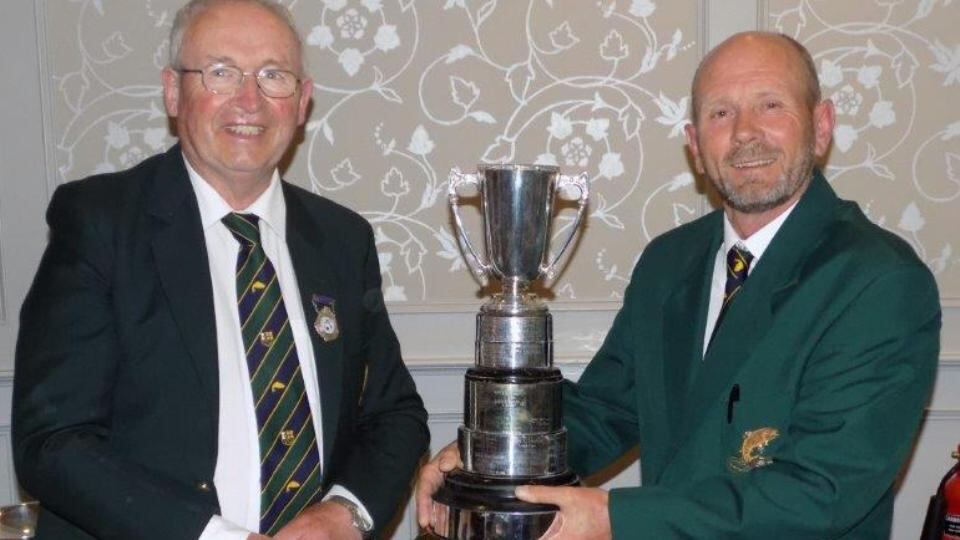 Ireland’s top rod: Noel Sheils, right, accepting the Perpetual Cup from IFFA president John Behan at the international competition on Lough Lein