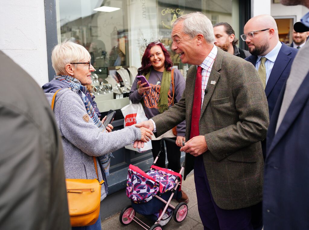 Reform UK leader Nigel Farage meets members of the public during campaigning in Caerphilly, South Wales. Photograph: Ben Birchall/PA