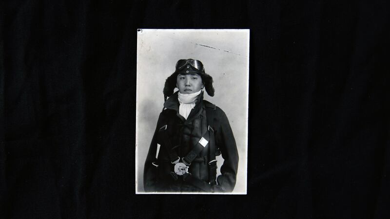 A portrait of Kazuo Odachi at age 18, in his pilot uniofrm, is displayed at his home in Tokyo. Photograph: Noriko Hayashi/The New York Times