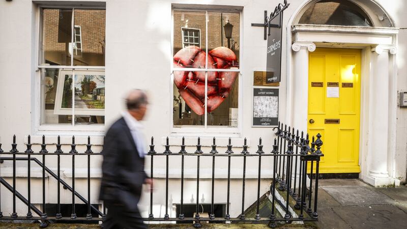 Serving as a symbol of hope for those who pass by, sculptor Patrick O’Reilly’s new work Hearts Held Together depicts the nation’s response to the Covid-19 crisis and is being displayed in the window of Gormleys Fine Art in South Frederick Street, Dublin. Photograph: Conor McCabe