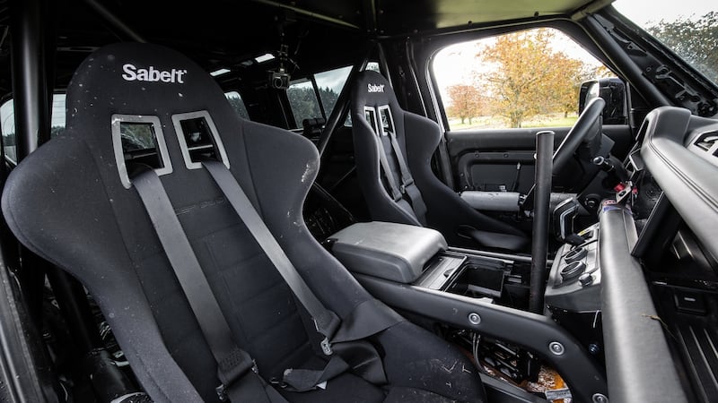Inside, the 007 Defender is a riot of cheap black plastic (no soft-touch trim for stunt cars), and buttock-clenching bucket seats