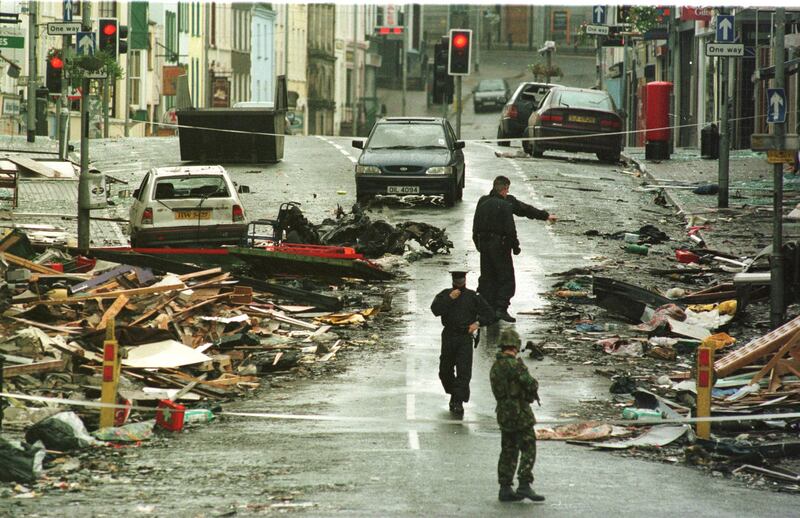 RUC personnel survey the aftermath of the Omagh car bomb. Photograph: Frank Miller / The Irish Times