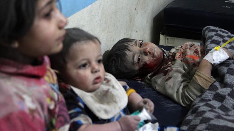 Wounded  children receive treatment at a makeshift hospital following an  air strike on the industrial area of Idlib on February 11th. Photograph:   Abdulaziz Ketaz/AFP via Getty Images