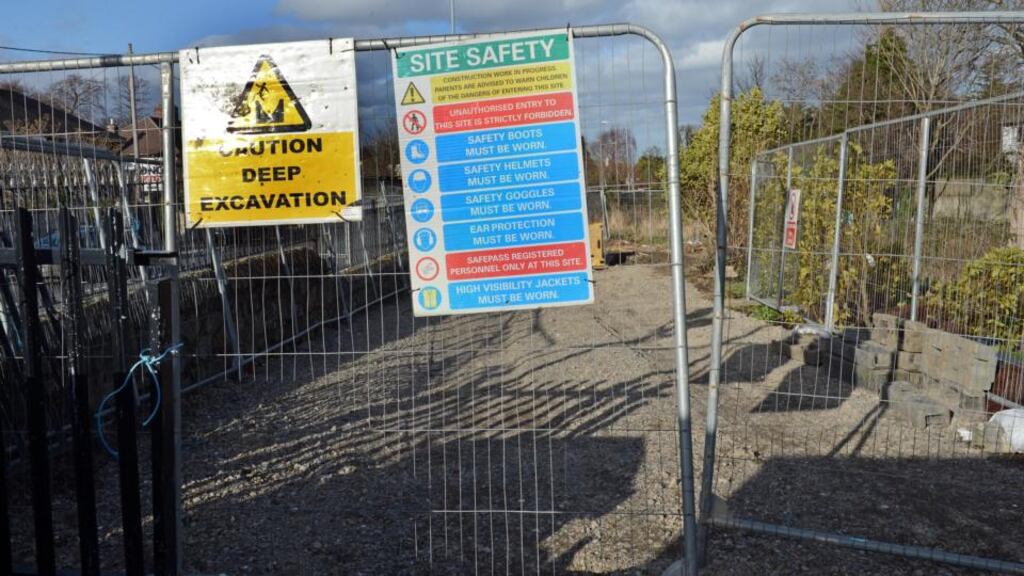 Contractors yesterday fenced off the site and erected “deep excavation” warnings ahead of work to temporarily fix the leak. Photograph: Eric Luke/The Irish Times