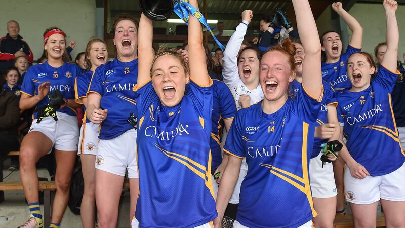 Tipperary captain Samantha Lambert lifts the cup after the Lidl Ladies National Football League Division 3 final replay against Wexford. Photograph: Matt Browne/Sportsfile