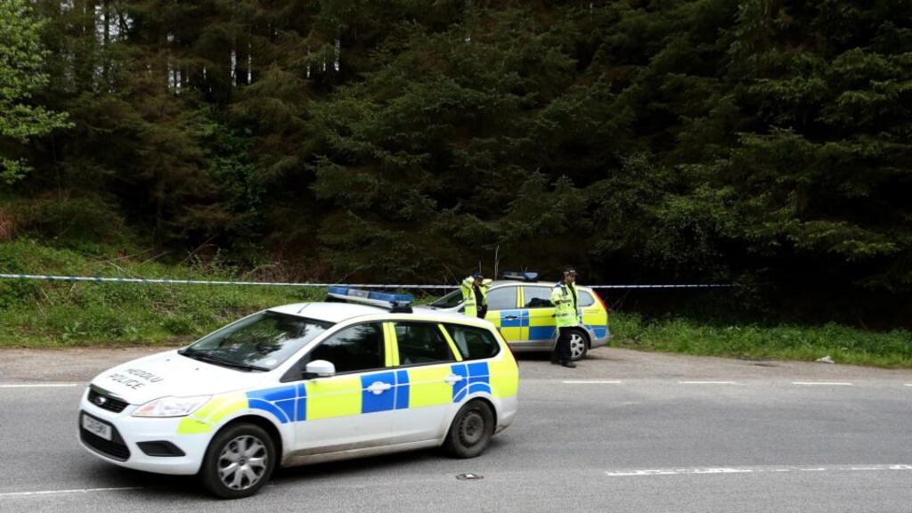 Police activity near the Nant-y-Garth pass near Wrexham, where the body of a young female has been found. Photograph: Peter Byrne/PA Wire