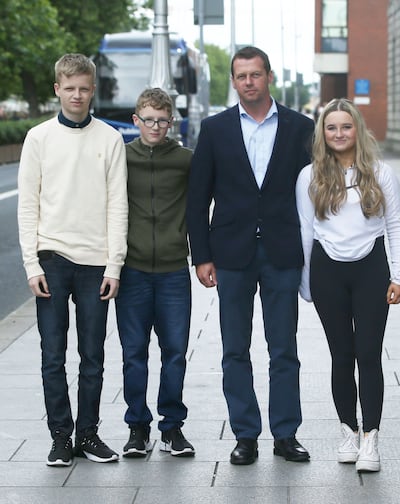John O'Meara, pictured with his children Aoife, Jack and Tommy, won his Supreme Court appeal over being refused the Widowers' Contributory Pension. Photograph: Collins Courts