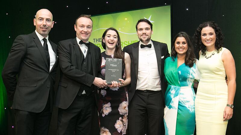 Sean McAuliffe, Co-Founder & Director, Sport Collective, presents the Best Sponsorship Team - Brand award to the AIG Insurance Marketing team.