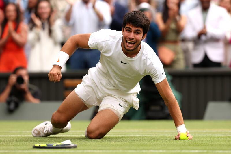 Carlos Alcaraz celebrates after the winning point on Centre Court. Photograph: Julian Finney/Getty Images