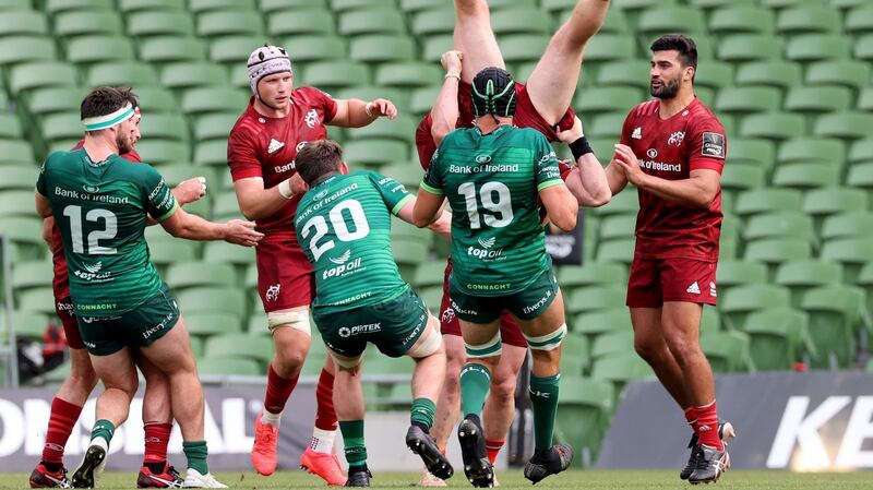 Chris Farrell lands awkwardly after catching a high ball during Munster’s win over Connacht. Photograph: Billy Stickland/Inpho
