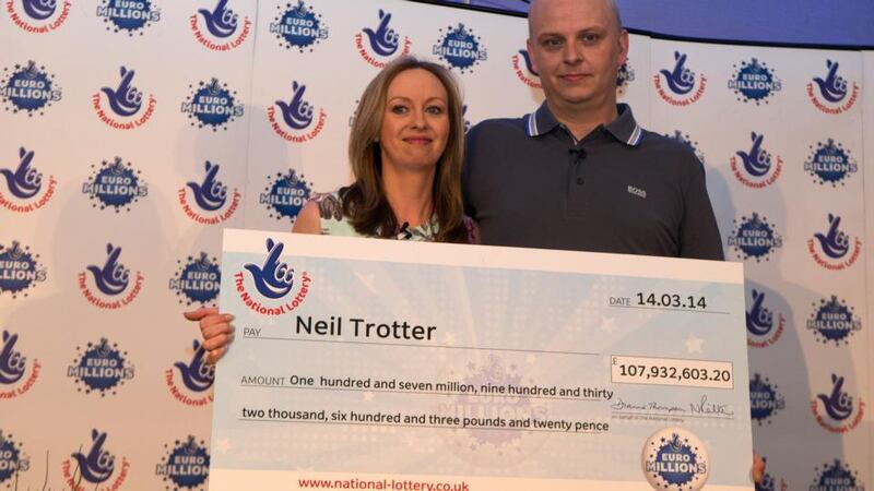 Car mechanic and racing driver Neil Trotter, with partner Nicky Ottaway, during a press conference in Dorking, Surrey where he was revealed as the man who scooped the latest Euromillions jackpot. Photograph: Steve Parsons/PA