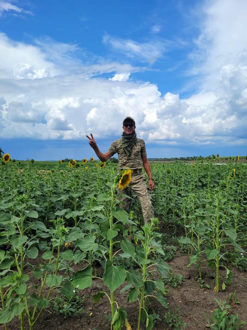Vadim Ovcharenko, who worked as a painter in Dublin, among sunflowers, a national symbol of Ukraine