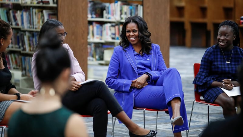 Michelle Obama beginning her book tour with a stop at the Whitney M Young Magnet High School in Chicago on Monday. Photograph: Kamil Krzaczynski/Reuters