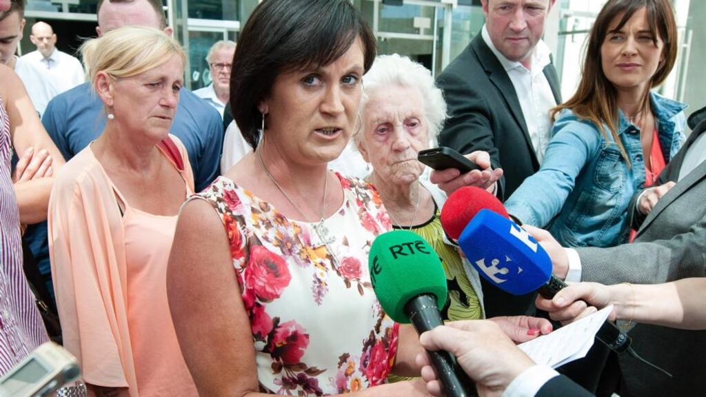 Stephen Hughes’s family and friends outside the court in Dublin yesterday including his mother Elizabeth Hughes and great-grandmother Mary McKeon. Photograph: Collins Courts
