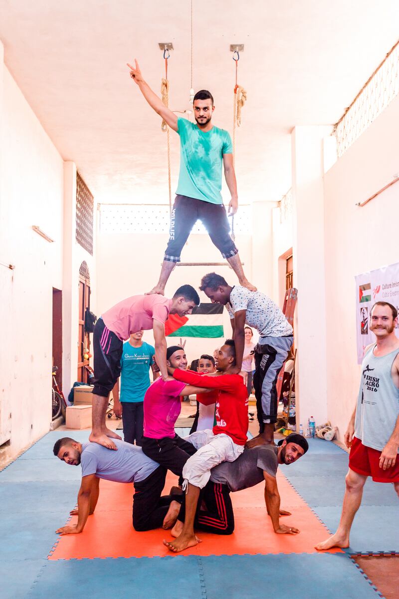 The team celebrate one of their first human towers