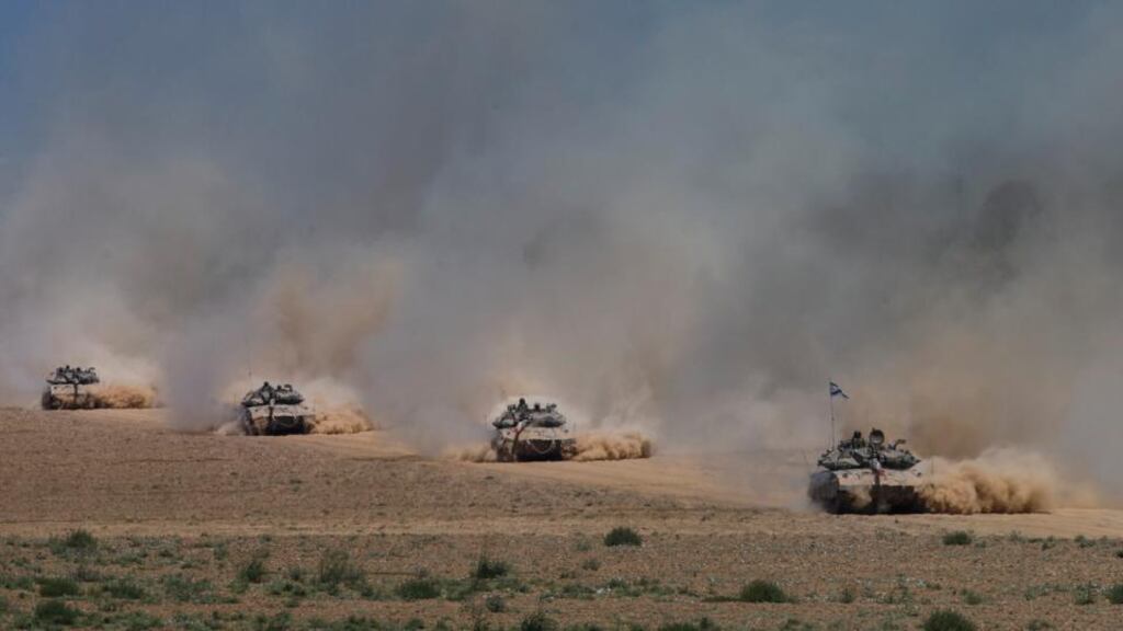 Israeli tanks pulling out of the Gaza Strip yesterday. Despite the unilateral redeployment, military officials have stressed that “Operation Protective Edge”, in its 28th day, continues. Photograph: Uriel Sinai/the New York Times