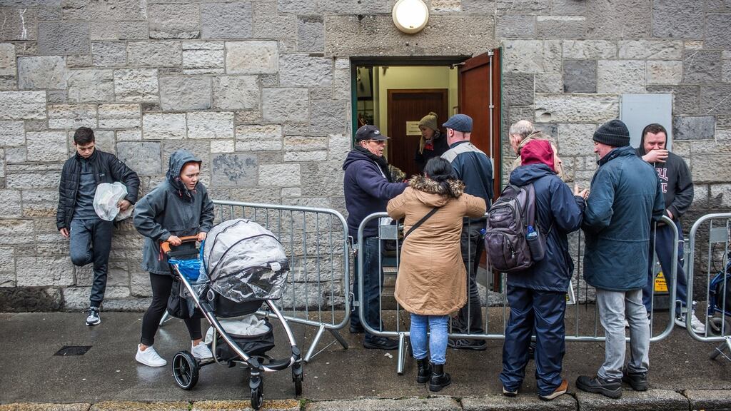 Many people arrived at the Capuchin Day Centre in Smithfield to collect Christmas parcels of food. Photograph: James Forde/ The Irish Times