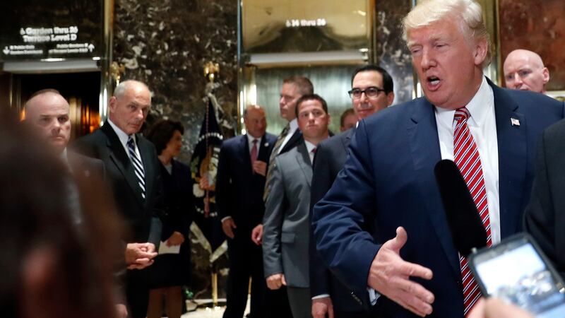 White House chief of staff John Kelly watches as President Donald Trump speaks to the media in the lobby of Trump Tower on August 15th. Photograph: Pablo Martinez Monsivais/AP