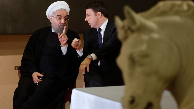 Iran’s president Hassan Rouhani and Italy’s prime minister Matteo Renzi talk during their meeting at the Campidoglio, Capitol Hill, in Rome, on Monday. Photograph: Gregorio Borgia/AP