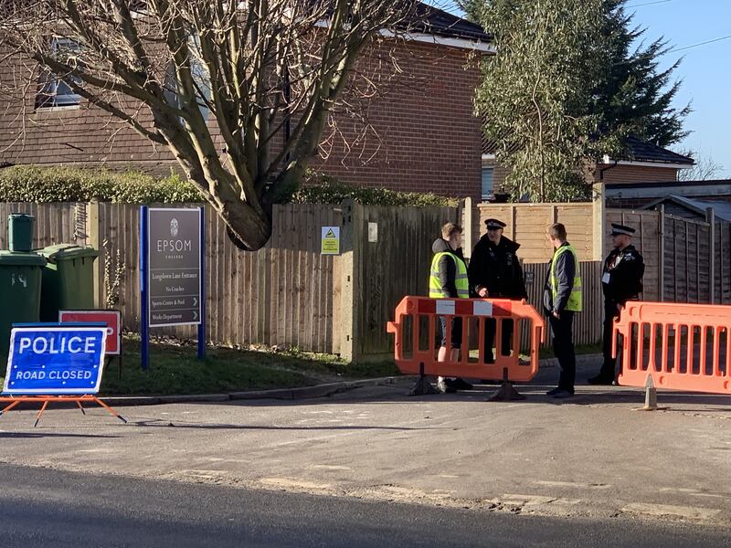 Police outside Epsom College in Surrey where the bodies of headmistress Emma Pattison, her husband and daughter were found. Photograph: PA