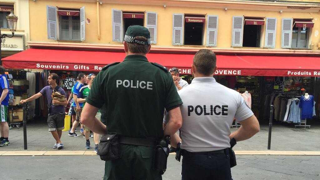 A Police Service of Northen Ireland officer with a gendarmerie in Nice, France. There was some minor overnight trouble in the city involving a small number of Northern Ireland fans ahead of the Group C game between the North and Poland at the Stade de Nice on Sunday evening. Photograph: Michael McHugh/PA Wire.