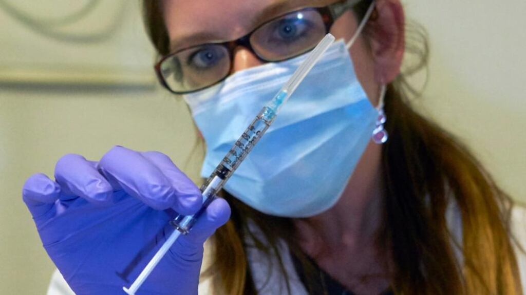 A nurse holds a syringe containing an experimental Ebola virus vaccine.  West African countries suffering an unprecedented epidemic of Ebola are particularly at risk of seeing a resurgence of malaria, says the WHO. Photograph: Denis Balibouse/Reuters