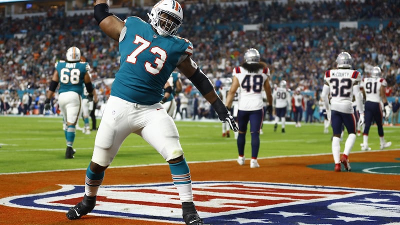 Austin Jackson celebrates a Duke Johnson touchdown in Miami’s win over New England. Photograph: Michael Reaves/Getty