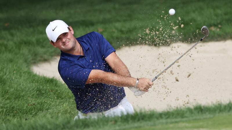 Reed plays from a greenside bunker. Photo: Jamie Squire/Getty Images