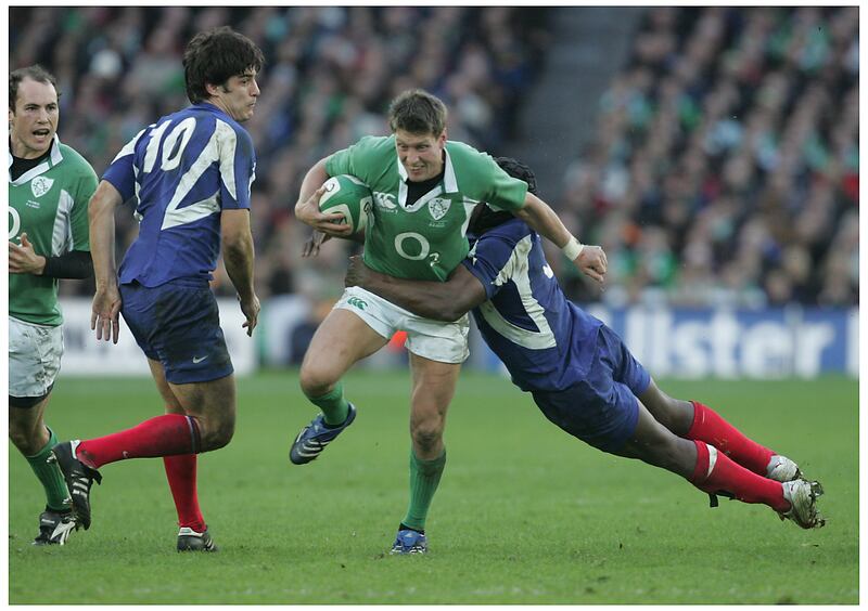 Ireland outhalf Ronan O'Gara is tackled by France's Serge Betsen during the 2007 Six Nations match at Croke Park. Photograph: Alan Betson