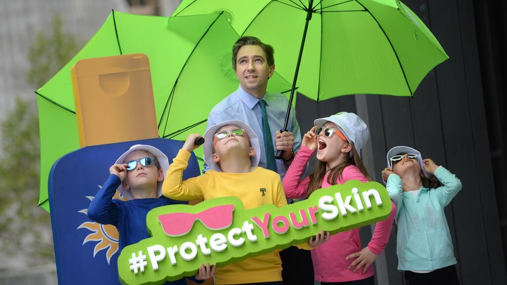 Minister for Health Simon Harris launching the first National Skin Cancer Policy, with help from Rory Daly, Eddie Daly, Molly O’Neill and Jasmine Le Ray, all from Marino, Dublin. Photograph: Dara Mac Dónaill/The Irish Times