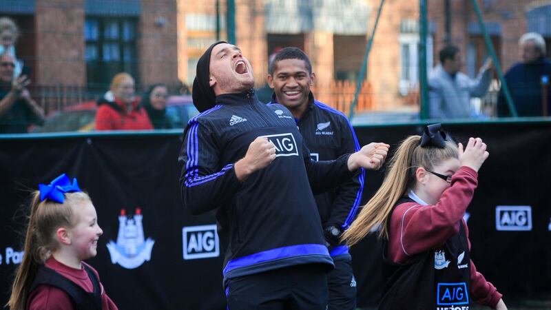 Israel Dagg and Waisake Naholo of the New Zealand All Blacks with children from St Laurence O’Toole’s GNS in Dublin. Photograph: Gareth Chaney Collins