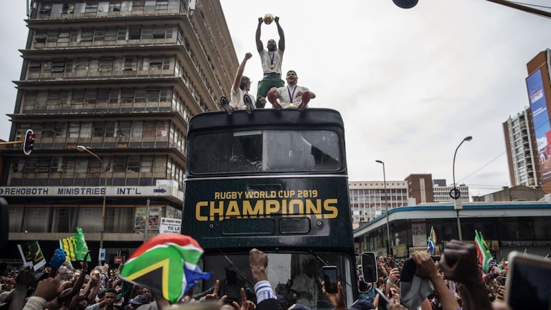 South African rugby captain Siya Kolisi ) holds up the Web Ellis trophy as the team parades through the streets of Johannesburg on Thursday. Photograph: Michele Spatari/AFP via Getty Images